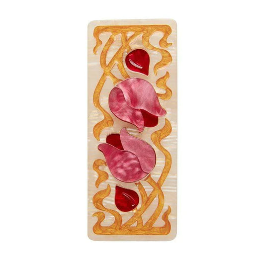 Erstwilder 'Flower and Thorn' brooch featuring red floral elements and gold vines on a cream base.